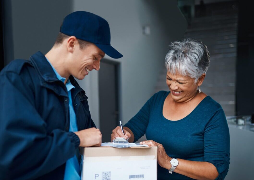 Package,,Delivery,Man,And,Woman,With,Clipboard,For,Signature,,Safety